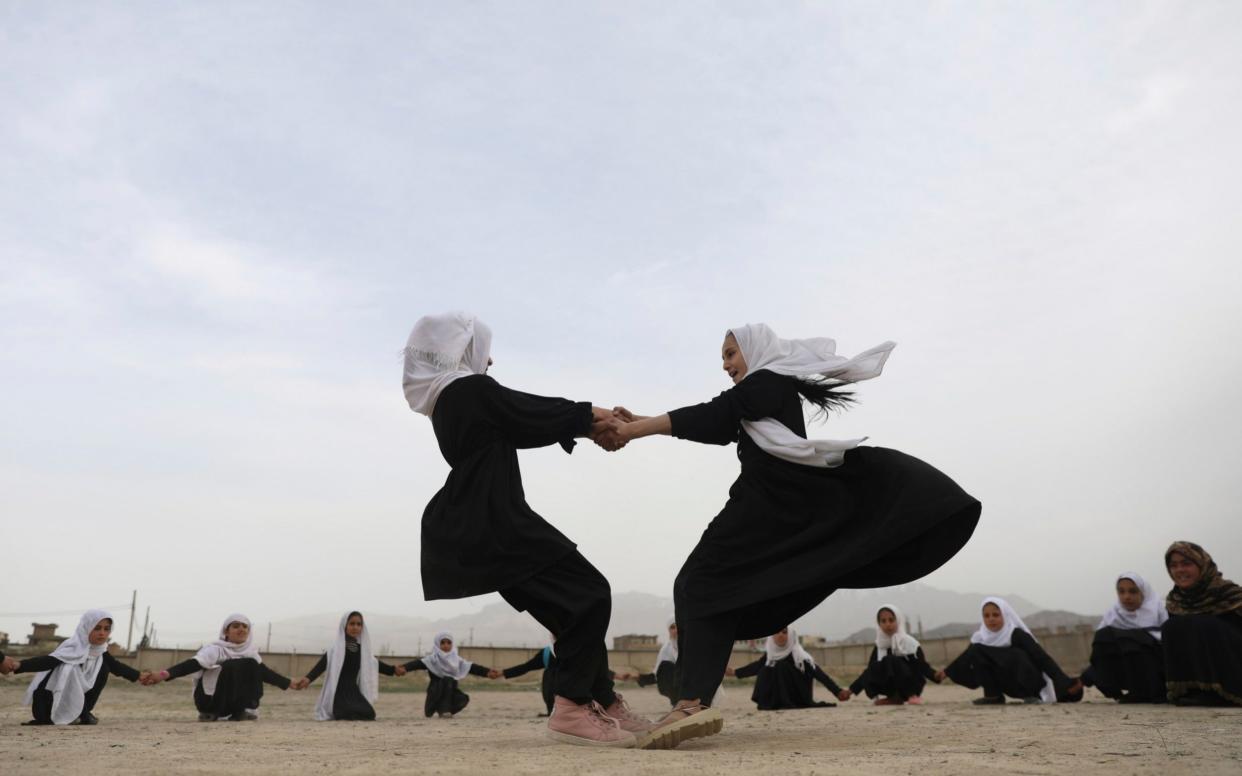 Afghan students play in a primary school in Kabul, Afghanistan, Saturday, March 27, 2021 - Rahmat Gul/AP