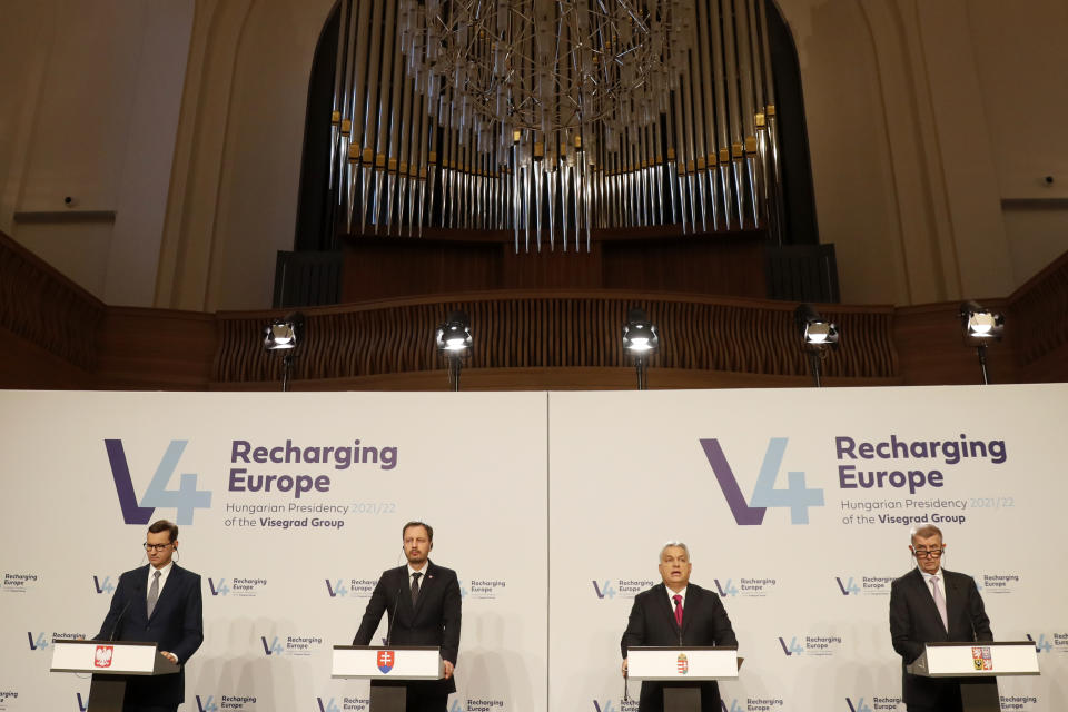 From left: Prime Ministers Mateusz Morawiecki of Poland, Viktor Orban of Hungary, Eduard Heger of Slovakia and Andrej Babis of the Czech Republic address the media at a news briefing in Budapest, Hungary, Tuesday, Nov. 23, 2021. The leaders of the Visegrad Four group of Central European countries met in Hungary's capital of Budapest Tuesday to discuss the ongoing migration crisis along Poland's border with Belarus. (AP Photo/Laszlo Balogh)