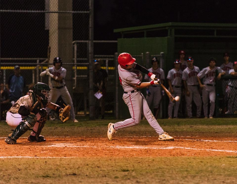 North Fort Myers Matthew Blasena connects on the end of his bat during Thursday's district final against Island Coast.