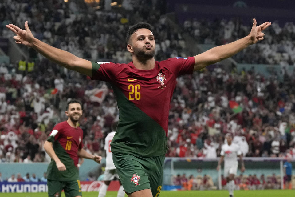 Portugal&#39;s Goncalo Ramos celebrates after scoring his side&#39;s fifth goal during the World Cup round of 16 soccer match between Portugal and Switzerland, at the Lusail Stadium in Lusail, Qatar, Tuesday, Dec. 6, 2022. (AP Photo/Alessandra Tarantino)