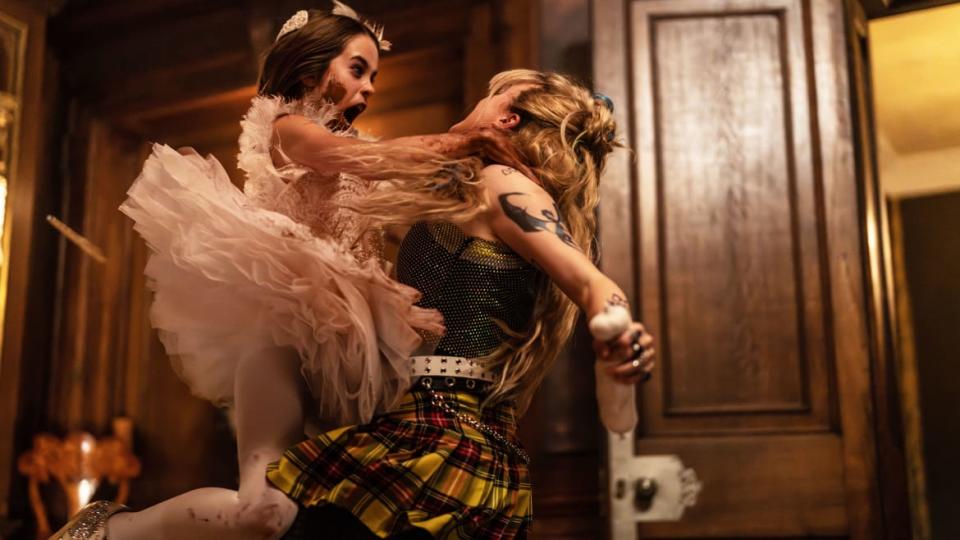 A photo still of Alisha Weir and Kathryn Newton in 'Abigail'