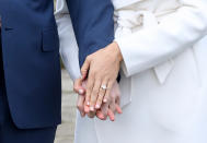 <p>The ring, the ring, the ring. That’s what you really want to see, right? The custom engagement ring features a trio of diamonds. The center stone is from Botswana — a country where the two have spent a significant amount of time, according to reports — and it’s flanked by two diamonds from Princess Diana’s personal collection. (If you recall, Prince William gave Kate Middleton Diana’s sapphire ring, so the men continue to honor their mother and incorporate her into their relationships.) The gems sit on a gold band that was made by the queen’s jeweler, Cleave and Co. (Photo: Chris Jackson/Getty Images) </p>