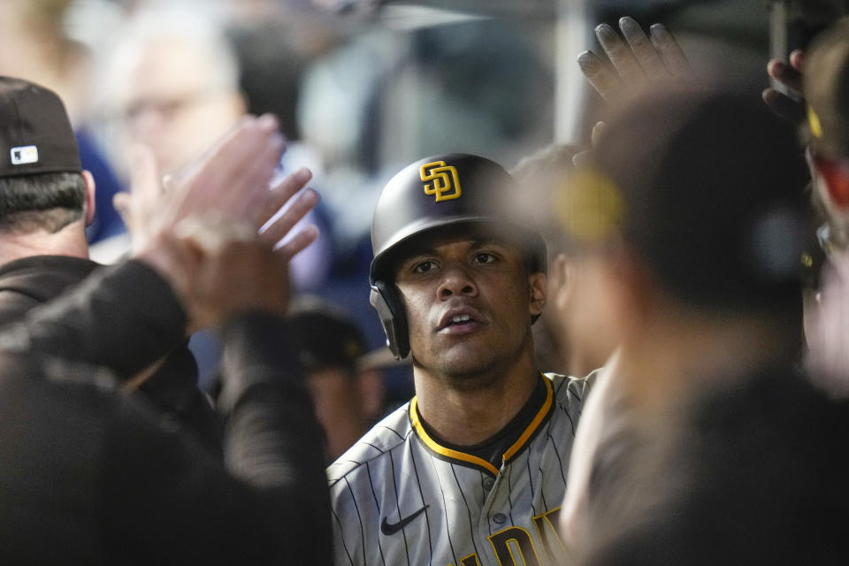 San Diego Padres' Juan Soto celebrates with teammates after hitting a two-run home run during the fifth inning of a baseball game against the New York Yankees, Friday, May 26, 2023, in New York. (AP Photo/Frank Franklin II)