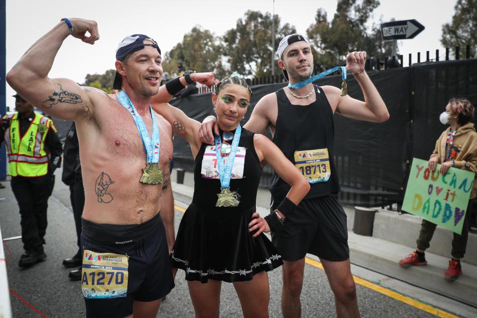 (L-R) Diplo, Alexi Pappas, and Cloonee pose for photos after finishing the Los Angeles Marathon on March 19, 2023 in Los Angeles, California.