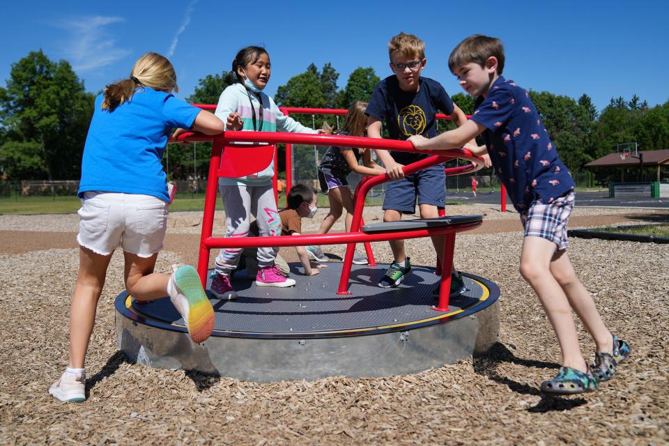 Students play together on the playground during Resilience Camp on Tuesday, June 28, 2022, at Spring Mill Elementary School in Indianapolis. The summer program invites Washington Township students grades K-5 to participate in a week of activities centered on social and emotional learning. 