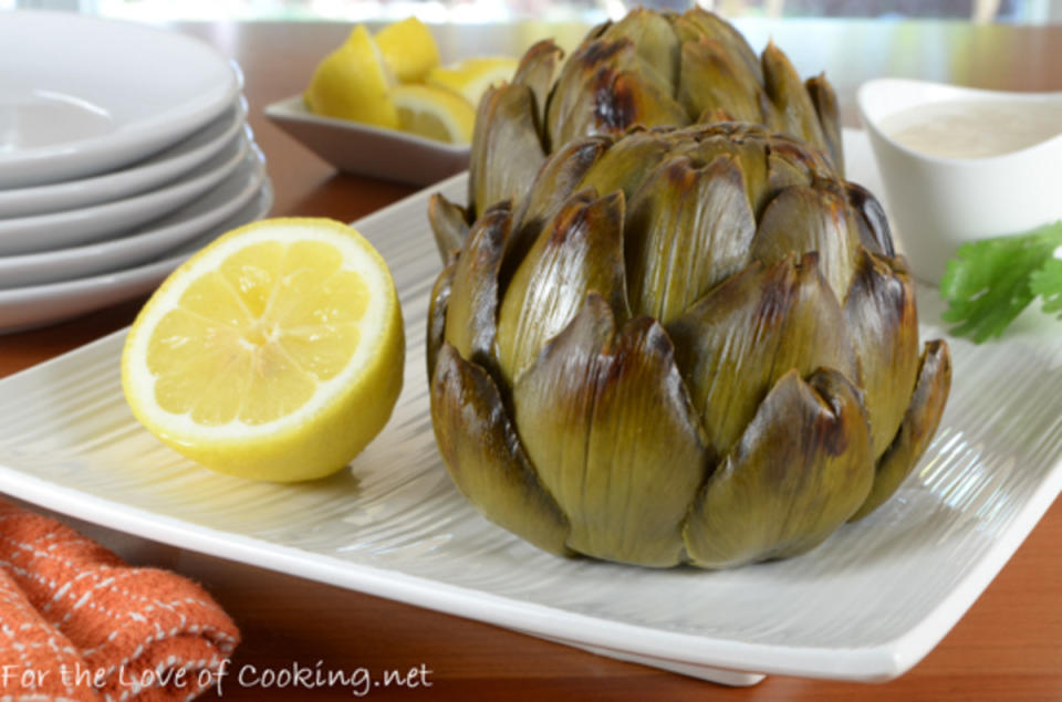 <p>For the Love of Cooking</p><p>The softened bits of garlic throughout these roasted artichokes are a wonderful and tasty surprise. </p><p><strong>Get the recipe:</strong> <a href="https://www.fortheloveofcooking.net/2017/07/whole-roasted-artichokes-with-lemon-garlic-aioli.html" rel="nofollow noopener" target="_blank" data-ylk="slk:Whole Roasted Artichokes with Lemon-Garlic Aioli;elm:context_link;itc:0;sec:content-canvas" class="link "><strong>Whole Roasted Artichokes with Lemon-Garlic Aioli</strong></a></p>