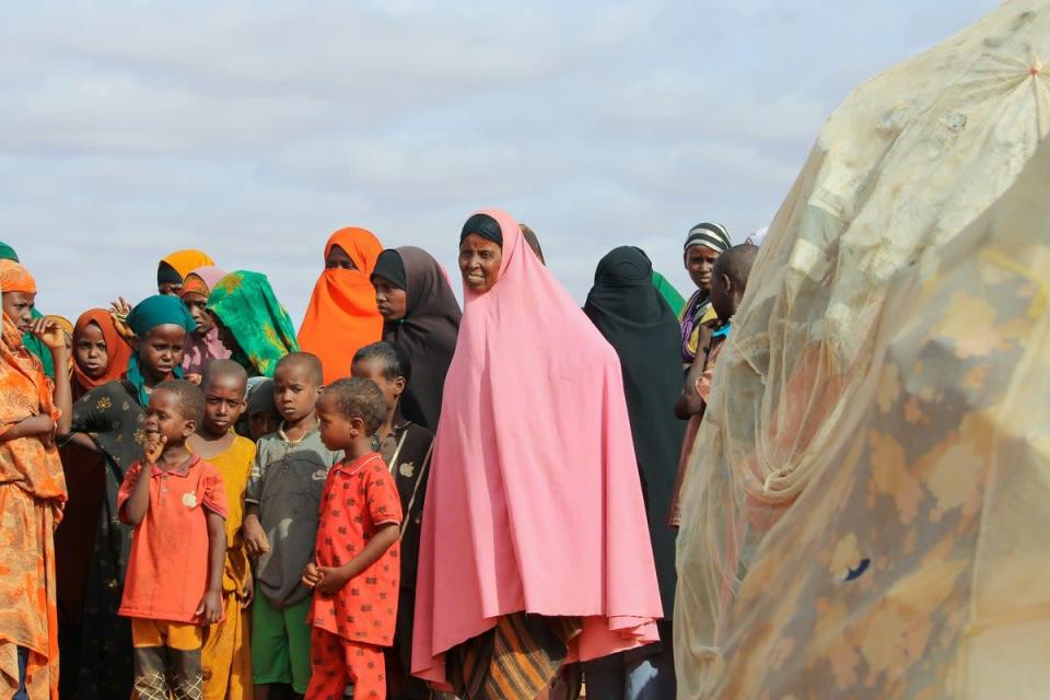 Internally displaced people near their makeshift tents at the Kabasa IDP camp (WFP/Samantha Reinders)