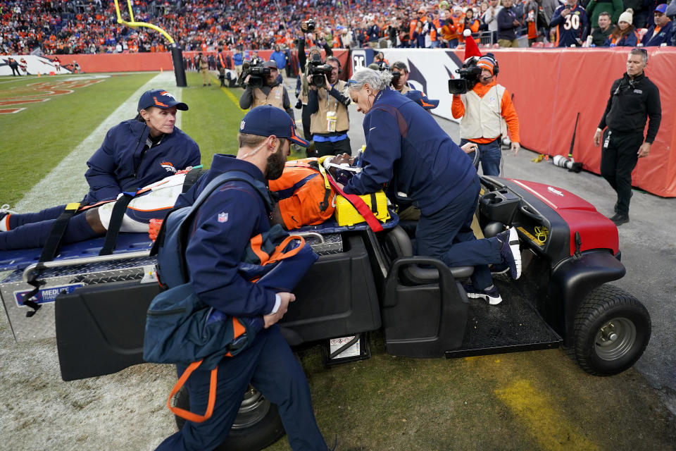 Denver Broncos quarterback Teddy Bridgewater is carted off the field after being injured against the Cincinnati Bengals during the second half of an NFL football game, Sunday, Dec. 19, 2021, in Denver. (AP Photo/Jack Dempsey)