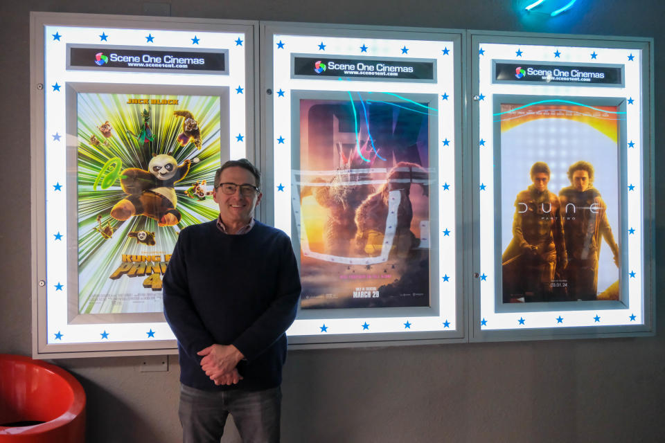 Joe Masher, CEO and owner of Scene One Entertainment, stands in the hallway the newly opened Scene One Westgate Mall Cinemas Wednesday at the grand opening of Amarillo's newest theater.