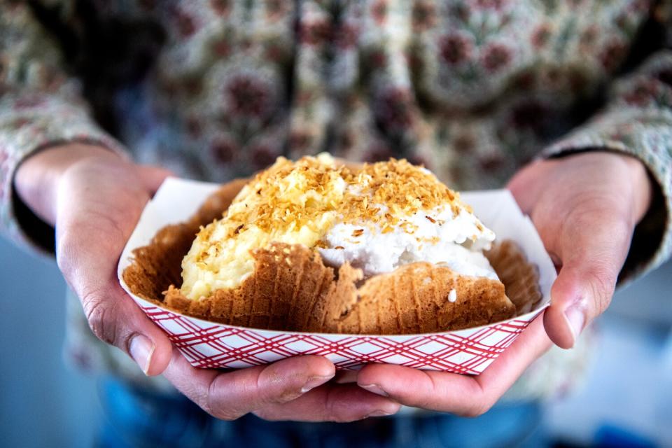 A waffle bowl holds a frozen dessert.