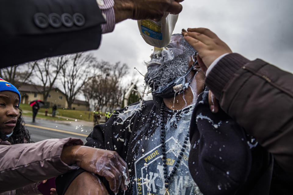 Protesters including a man who got pepper-sprayed, confronted police over the shooting death of Daunte Wright at a rally at the Brooklyn Center Police Department in Brooklyn Center, Minn., Monday, April 12, 2021. (Richard Tsong-Taatarii/Star Tribune via AP)