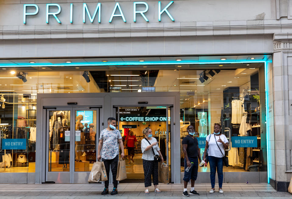 Shoppers stand in front of the Primark shop window at Oxford Street as Coronavirus lockdown eases in London, England, United Kingdomon, August 11, 2020. Lockdown forced many retailers to limit operations of its high street shops. (Photo by Dominika Zarzycka/NurPhoto via Getty Images)