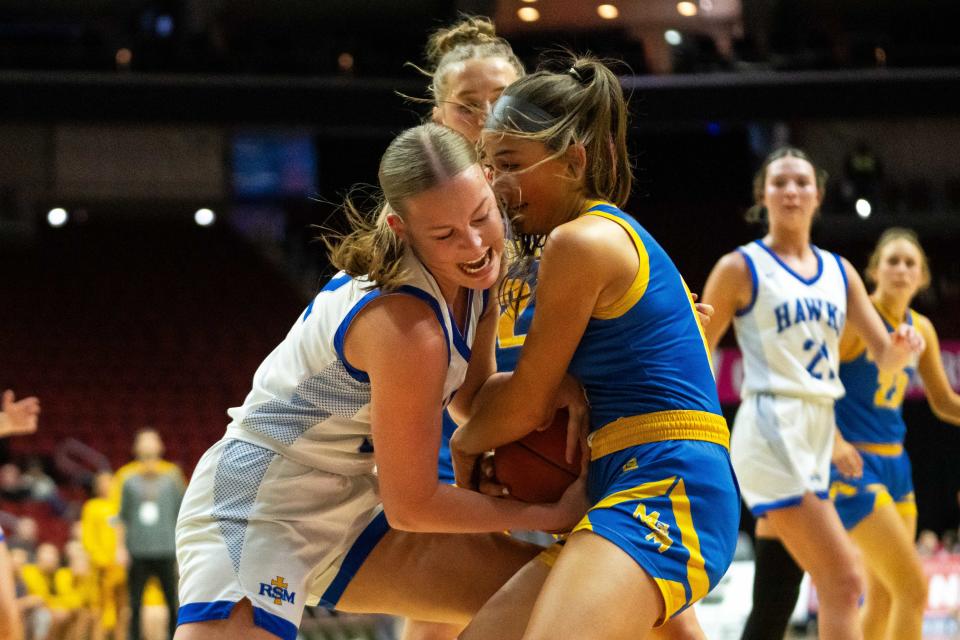 Remsen St. Mary's Tessa Tentinger (left) and Martensdale St. Marys' Ellie Baker (right) fight for posession of the ball Wednesday, Feb. 28, 2024, at Wells Fargo Arena.