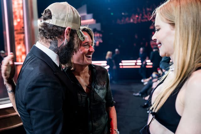 <p>John Shearer/Getty Images for CMAs</p> ost Malone, Keith Urban and Nicole Kidman share a laugh at the CMA Awards at Bridgestone Arena on Nov. 8, 2023 in Nashville