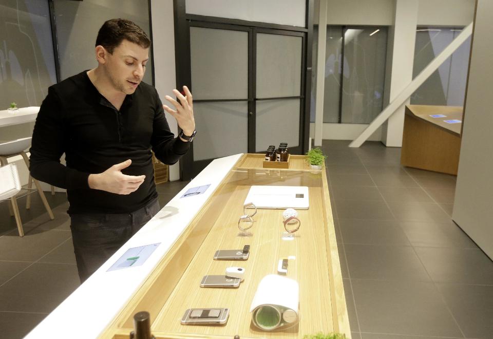 In this Jan. 10, 2017 photo, Adrian Aoun, founder and CEO of Forward, shows a retail sensor section of various wearables and phone attachments at a medical office in San Francisco. After a relative suffered a heart attack a few years ago, Silicon Valley entrepreneur Aoun got an up-close look at a health-care system that he diagnosed as an inefficient and outdated mess. Now, Aoun is ready to prescribe his remedy. It's called Forward, a health-management service that charges a $149 per month, roughly $1,800 a year, to tend to all of its patients' primary-care needs. (AP Photo/Jeff Chiu)