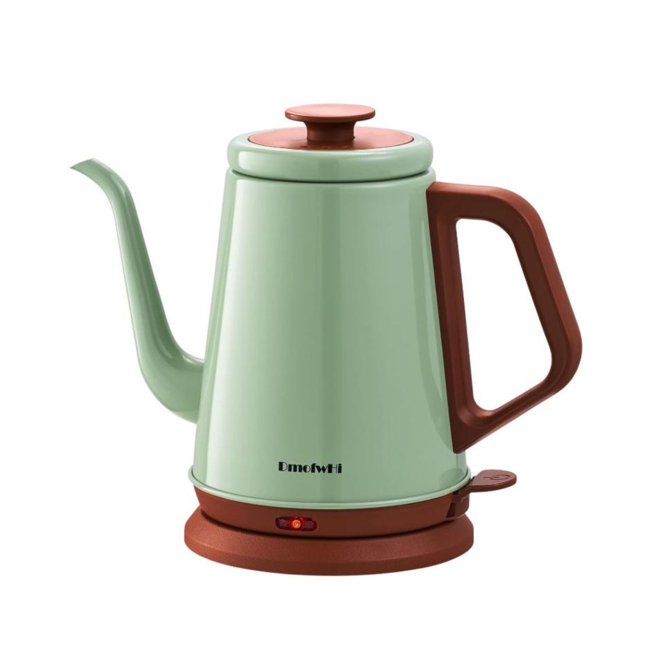 A mint green and copper electric kettle with a gooseneck spout