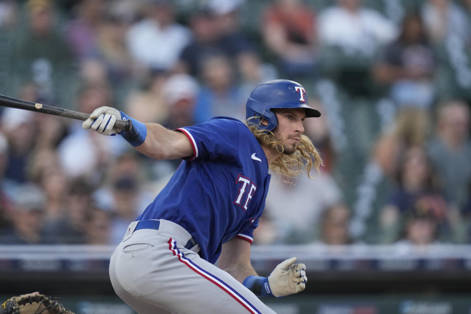 Texas Rangers' Travis Jankowski follows through on his RBI double during the fourth inning of a baseball game against the Detroit Tigers, Tuesday, May 30, 2023, in Detroit. (AP Photo/Carlos Osorio)