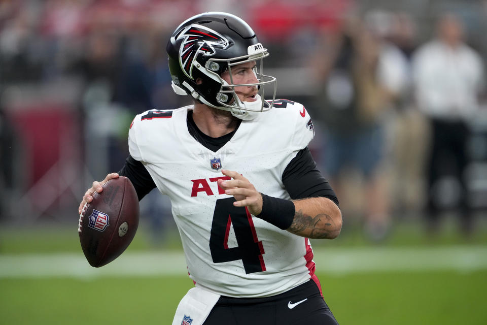 Atlanta Falcons quarterback Taylor Heinicke (4) works in the pocket against the Arizona Cardinals during the first half of an NFL football game, Sunday, Nov. 12, 2023, in Glendale, Ariz. (AP Photo/Matt York)