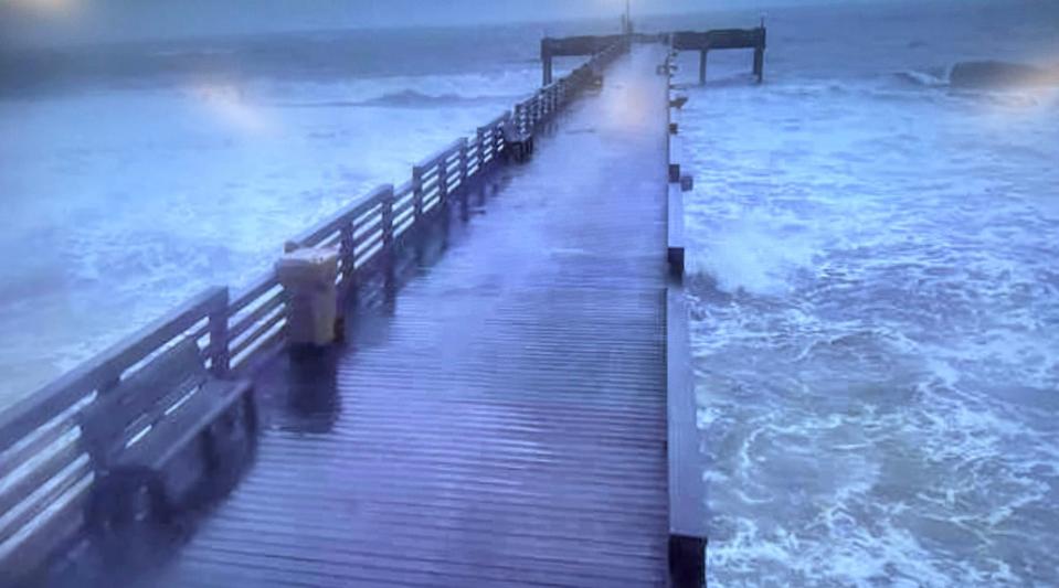 High surf at the Venice Municipal Fishing Pier Wednesday morning. The pier remains closed.