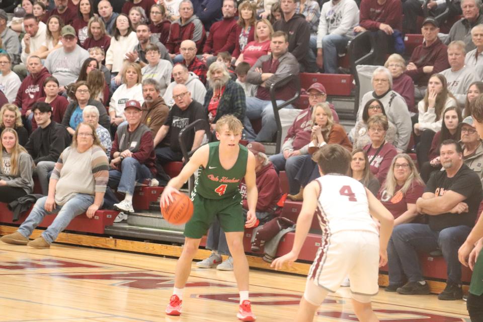 Oak Harbor's Carson Slates handles the ball.