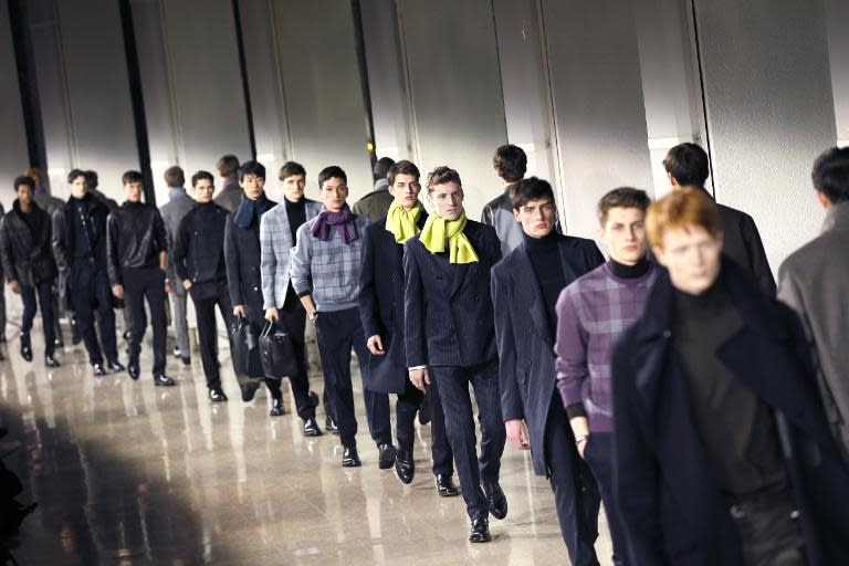 Models present creations by Hermes during the men's Fall/Winter 2015 ready-to-wear collection fashion show in Paris on January 24, 2015