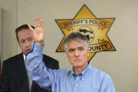 Cook County Sheriff Tom Dart, foreground, responds to a question, accompanied by Sheriff's Detective Lt. Jason Moran, after Dart announced the identity of "Gacy Victim 5" as North Carolina native Francis Wayne Alexander during a news conference Monday, Oct. 25, 2021, in Maywood, Ill. Alexander's body was among 26 discovered by police in the crawl space of John Wayne Gacy's home more than 40 years ago, with three more found outside the house and four others found in waterways that Gacy admitted killing. Police were able to identify 25 of the victims but the final eight, Alexander among them, were buried without having ever been identified. (AP Photo/Charles Rex Arbogast)