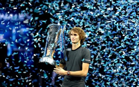 Alexander Zverev of Germany celebrates victory with the trophy following the singles final against Novak Djokovic - Credit: Getty