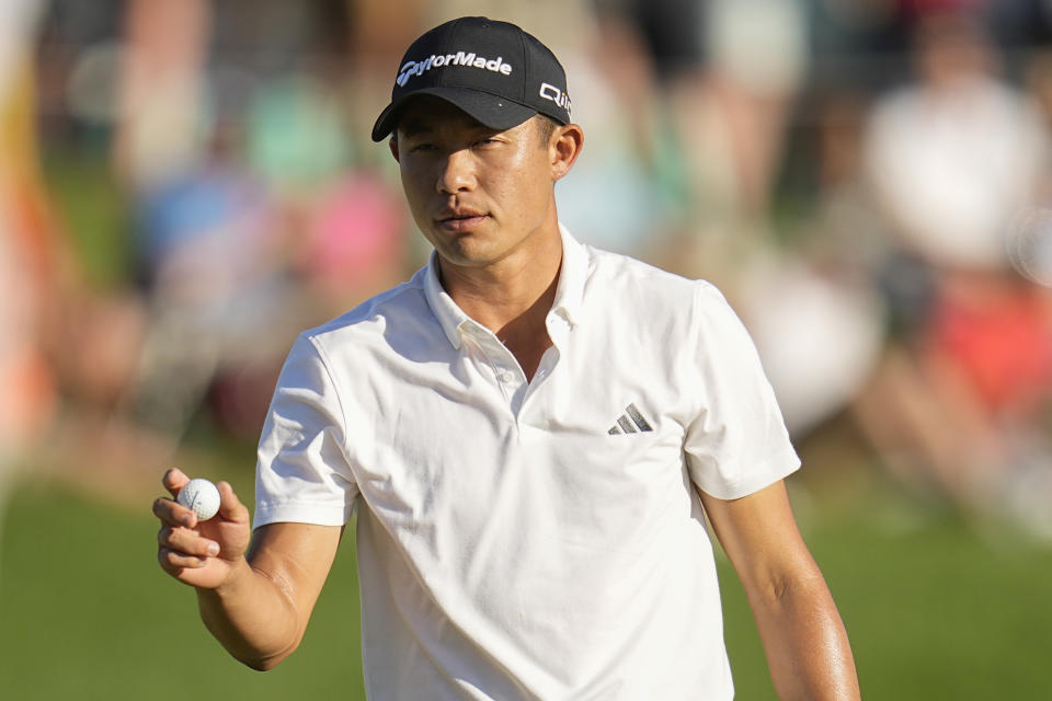 Collin Morikawa waves after making a putt on the 18th hole during the third round of the PGA Championship golf tournament at the Valhalla Golf Club, Saturday, May 18, 2024, in Louisville, Ky. (AP Photo/Sue Ogrocki)