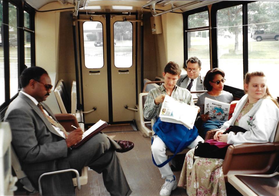 Take a peek inside a vintage COTA vehicle: Customers of the past busy themselves with newspapers and journals, long before COTA began offering free Wi-Fi onboard.