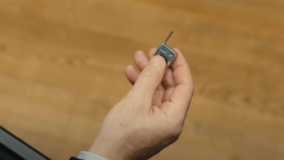 The mini-radio transmitter, held up close, in Skyfall.