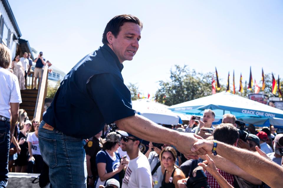 GOP presidential candidate Ron DeSantis shakes hands with supporters during Gov. Kim Reynolds' Fair-Side Chat during day three of the Iowa State Fair on Saturday, August 12, 2023 in Des Moines.