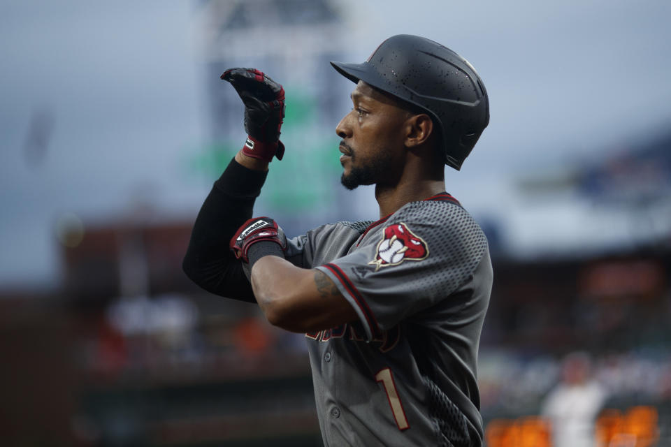 Arizona Diamondbacks' Jarrod Dyson reacts as he walks back to the dugout after hitting a home run off Philadelphia Phillies starting pitcher Jerad Eickhoff during the first inning of a baseball game, Monday, June 10, 2019, in Philadelphia. (AP Photo/Matt Slocum)