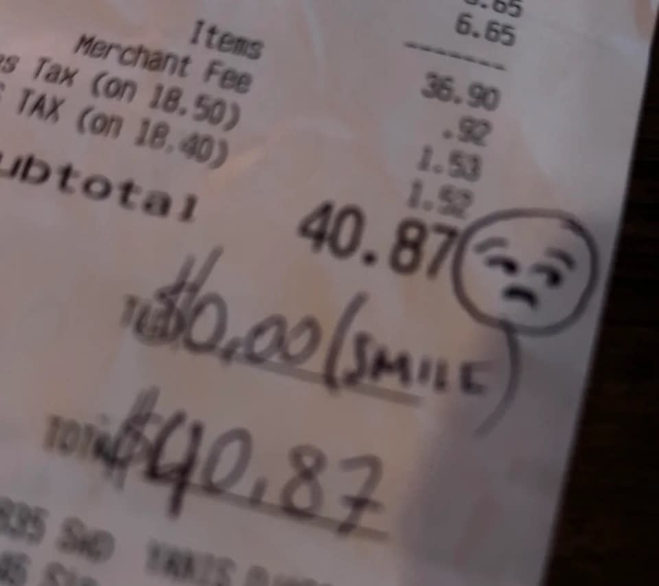 Receipt with handwritten note, total of $40.87, and a drawn unhappy face with word "SMILE"