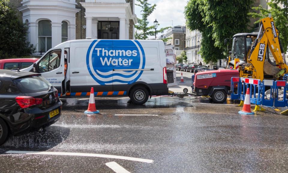 <span>Thames Water attends to a burst main in Earl's Court, London.</span><span>Photograph: Jansos/Alamy</span>