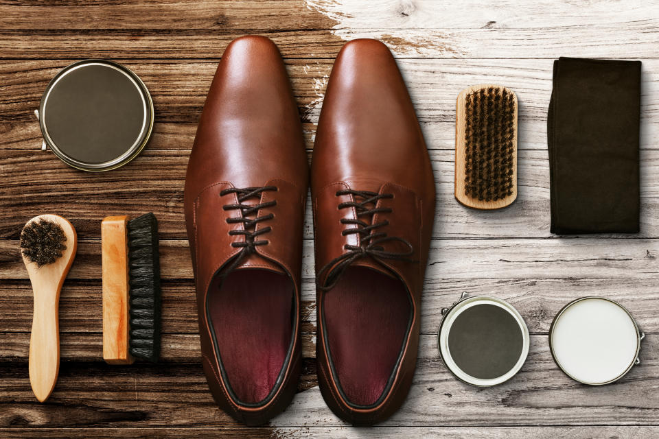 Men’s leather shoes flat lay with polishing tools