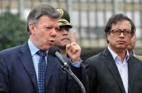 El alcalde de Bogotá, Gustavo Petro, asiste a un discurso del presidente de Colombia, Juan Manuel Santos, el 2 de julio de 2013 (AFP/Archivos | Guillermo Legaria)