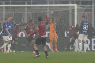 AC Milan's Fikayo Tomori, second right, celebrates after scoring his side's opening goal during a Serie A soccer match between AC Milan and Inter Milan at the San Siro stadium in Milan, Italy, Monday, April 22, 2024. (AP Photo/Luca Bruno)