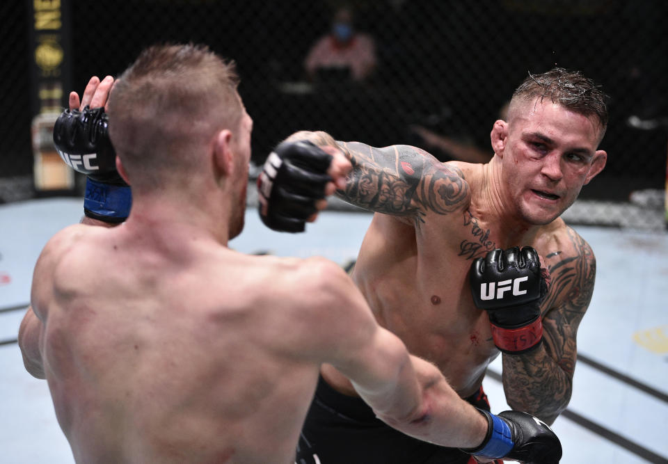 LAS VEGAS, NEVADA - JUNE 27: (R-L) Dustin Poirier punches Dan Hooker of New Zealand in their lightweight fight during the UFC Fight Night event at UFC APEX on June 27, 2020 in Las Vegas, Nevada. (Photo by Chris Unger/Zuffa LLC)