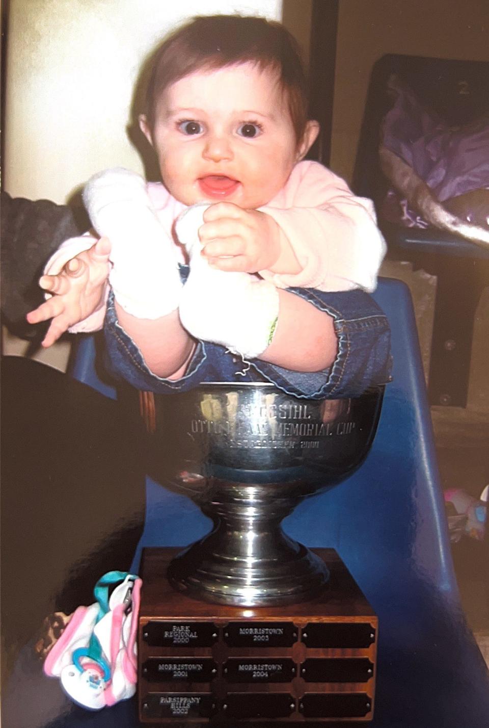 Samantha Levis poses in the 2005 Haas Cup, which her father Tom Levis won as coach of Park Regional. She is now a freshman at the University of Delaware.