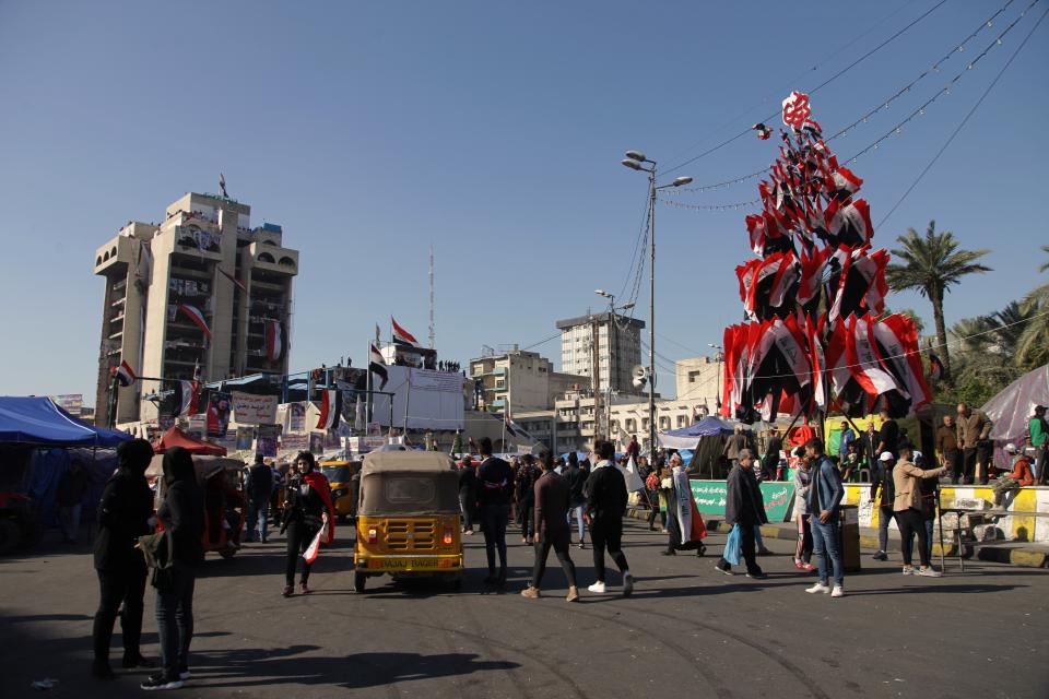 Anti-government protesters stage a sit-in at Tahrir Square during anti-government demonstrations in Baghdad, Iraq, Tuesday, Dec. 24, 2019. (AP Photo/Khalid Mohammed)