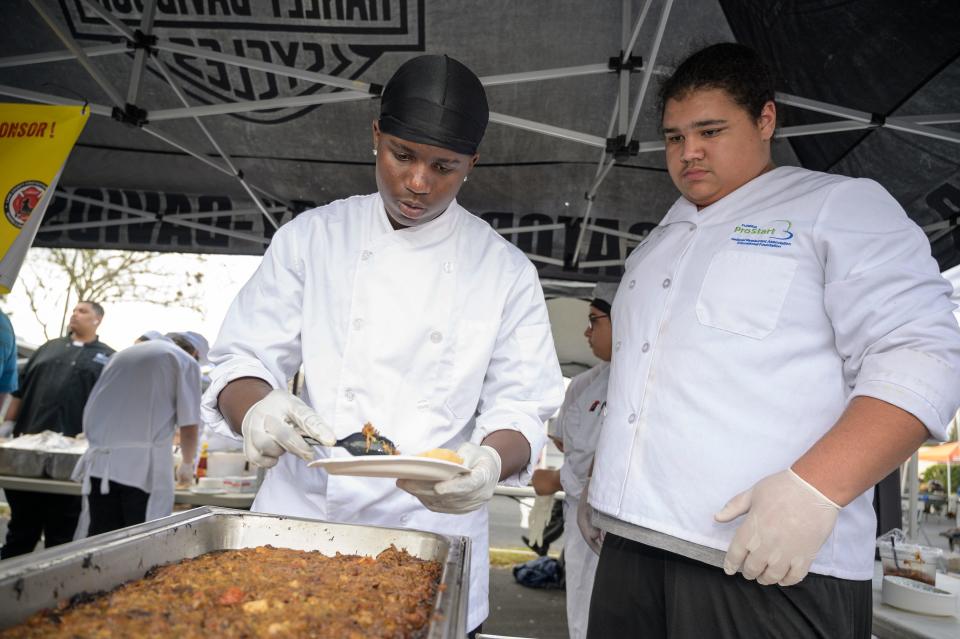 Students from the Leesburg culinary department fix a plate at the 7th annual Chairty Chili Cook-off and BBQ Competition in 2020.