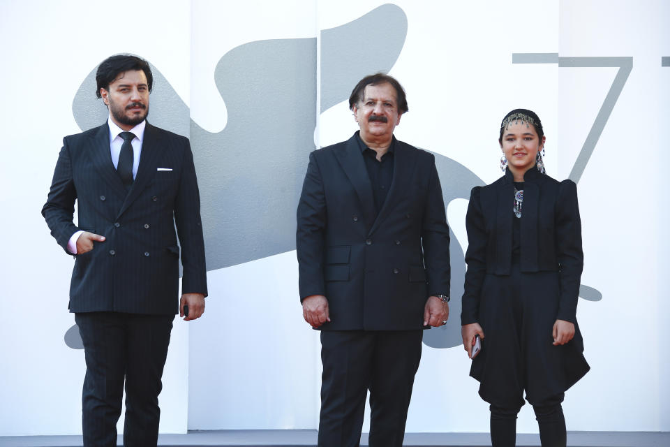 Actor Javad Ezati, from left, director Majid Majidi, and actress Shamila Shirzad pose for photographers upon arrival at the premiere of the film 'Khorshid (Sun Children)' during the 77th edition of the Venice Film Festival in Venice, Italy, Sunday, Sept. 6, 2020. (Photo by Joel C Ryan/Invision/AP)