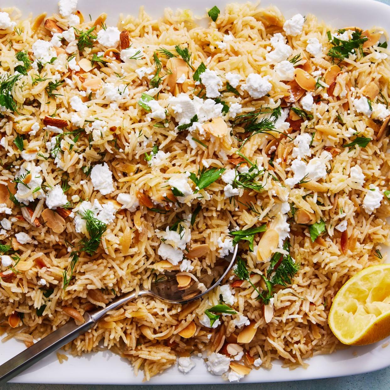 lemon herb rice pilaf topped with almonds, feta, and parsley