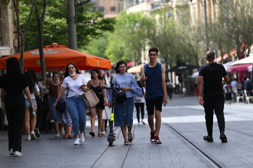 People walk outside without masks on in Jerusalem