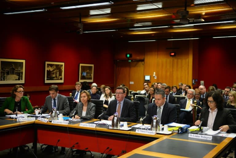 Representatives from the world's top pharmaceutical companies attend an Australian parliamentary hearing in Sydney on July 1, 2015