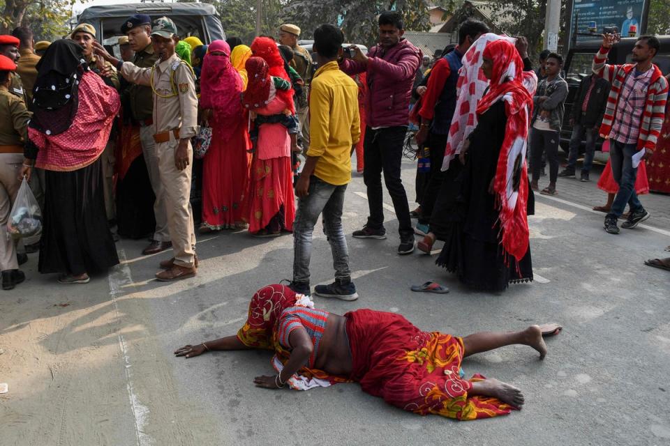 Relatives of people arrested by police for being allegedly involved in child marriages stage protest (AFP via Getty Images)