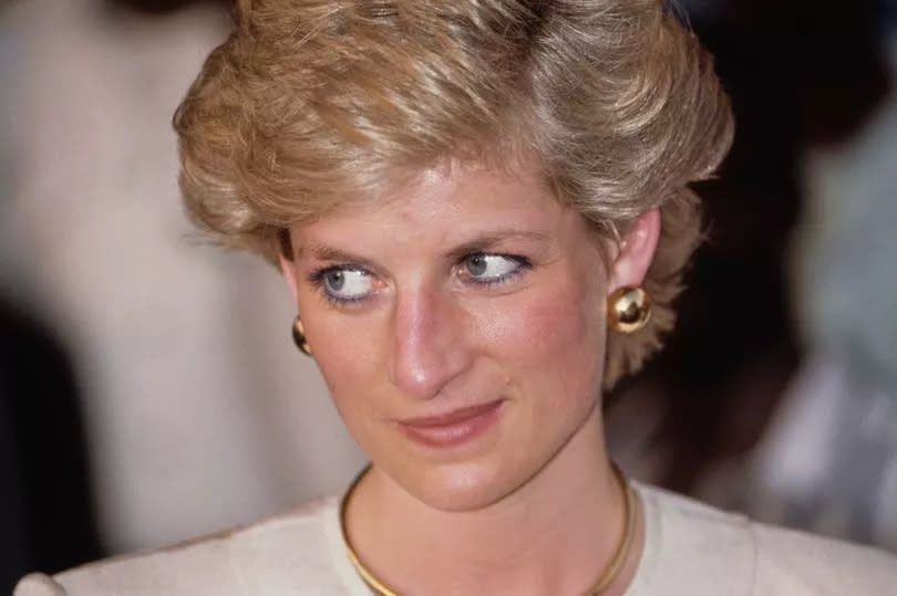 Princess Diana wore a gold necklace with large gold studs on her visit to Nigeria in 1990