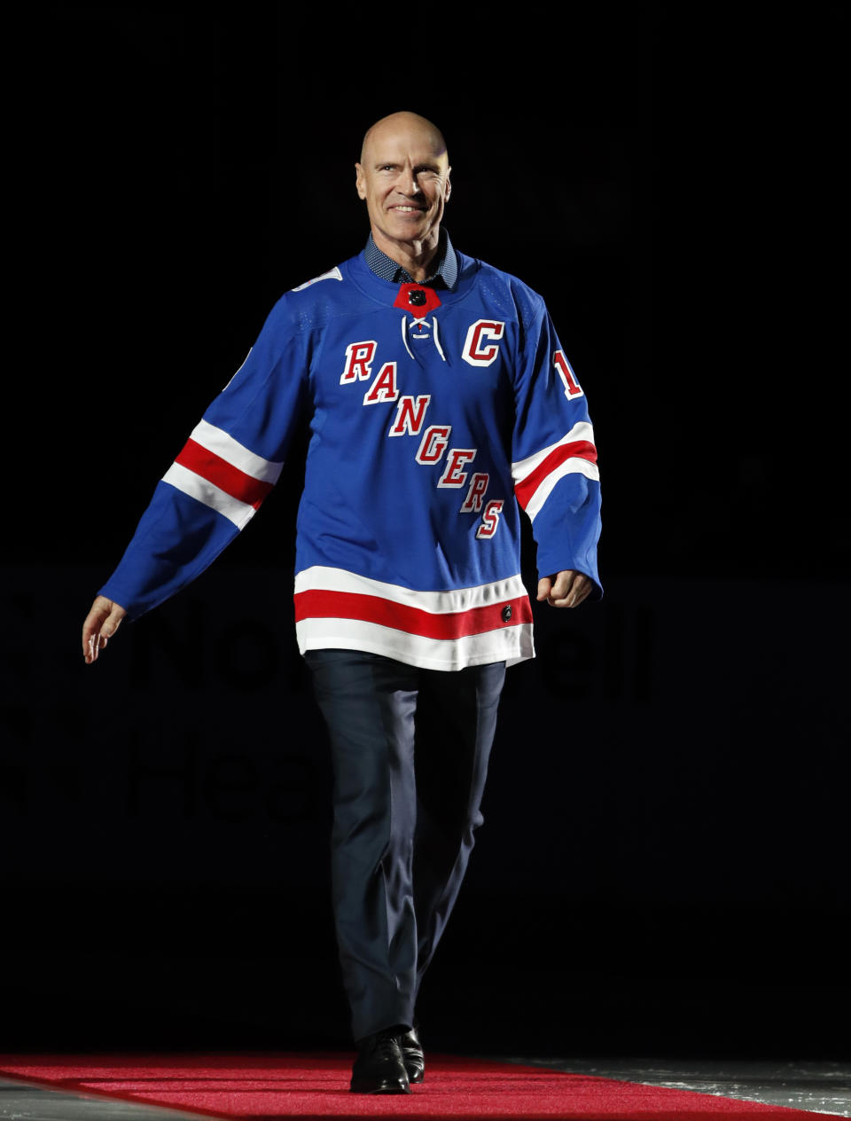 FILE - Former New York Rangers center Mark Messier appears at a ceremony retiring the number for New York Rangers Hall of Famer Jean Ratelle before an NHL hockey game in New York on Feb. 25, 2018. Messier’s memoir “No One Wins Alone” will be published in October, by Gallery Books, a Simon & Schuster imprint. (AP Photo/Kathy Willens, File)
