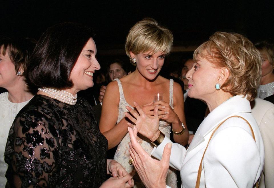 <p>As Barbara Walters chatted up Princess Diana and her friend, Lucia Flecha de Lima, the news broadcaster wore a crisp white blazer and pale blue statement earrings. </p>