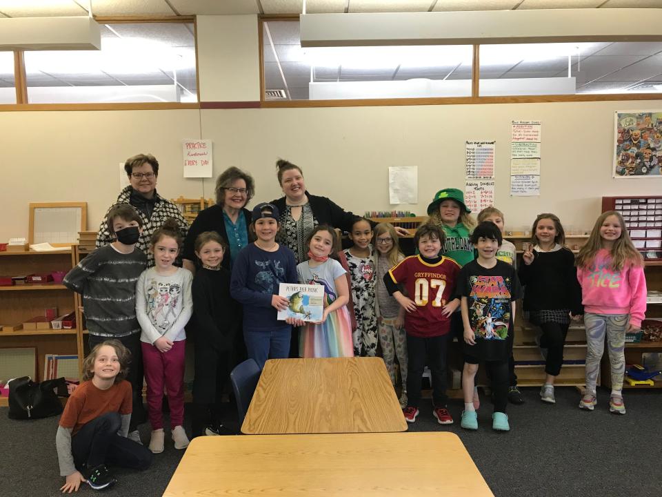 Lydia Dreyer’s class at Montessori Academy in Mishawaka poses with author Phyllis Wezeman, rear, second from left. The Mishawaka resident has been visiting local classrooms and giving away copies of “Petra’s Pier Picnic,” her book about combating hunger, in memory of Sarah Proctor, a local teacher who died Dec. 2, 2022, in a car accident.